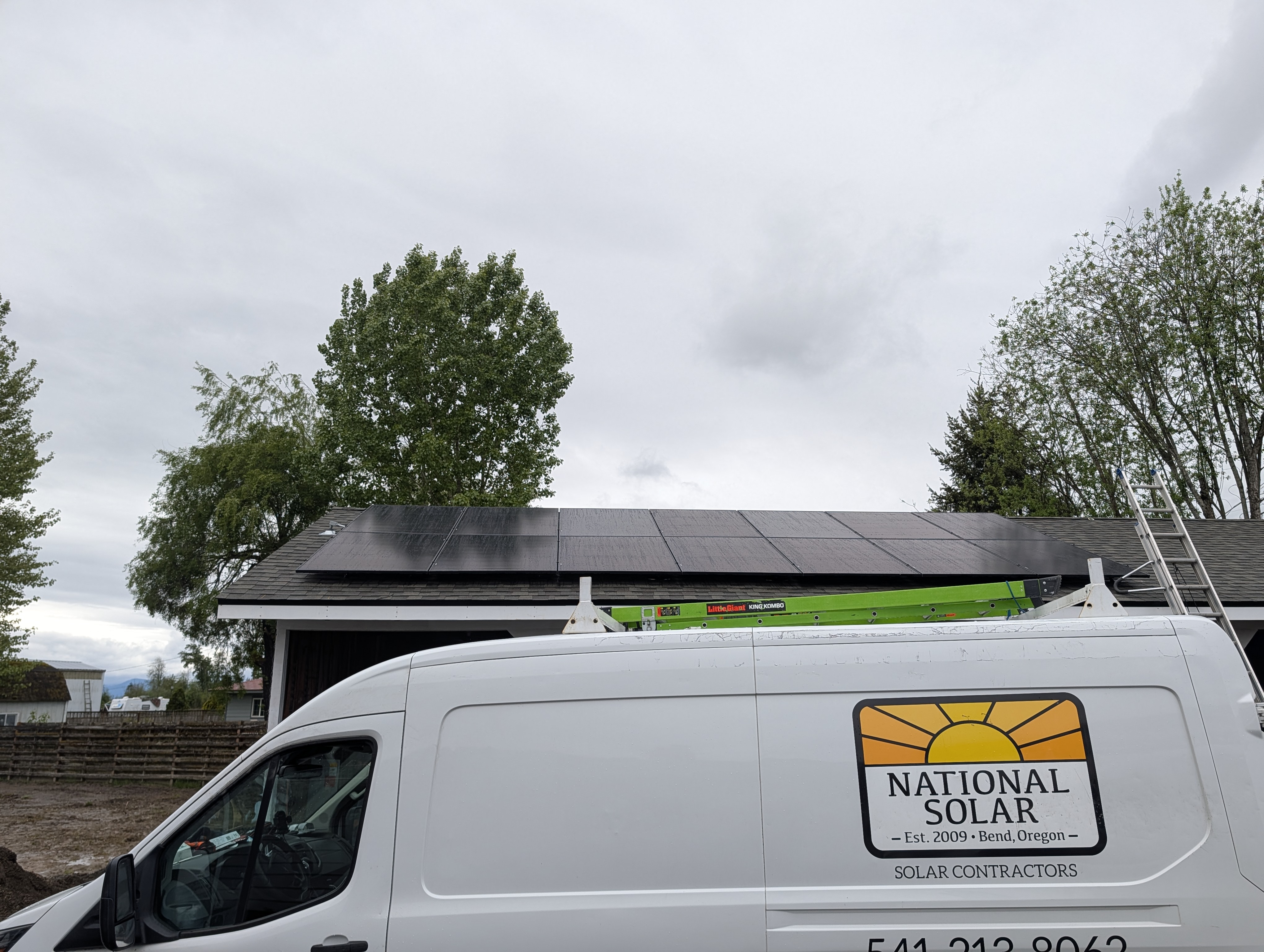 National Solar work van parked at a Bend, Oregon home with newly installed rooftop solar panels